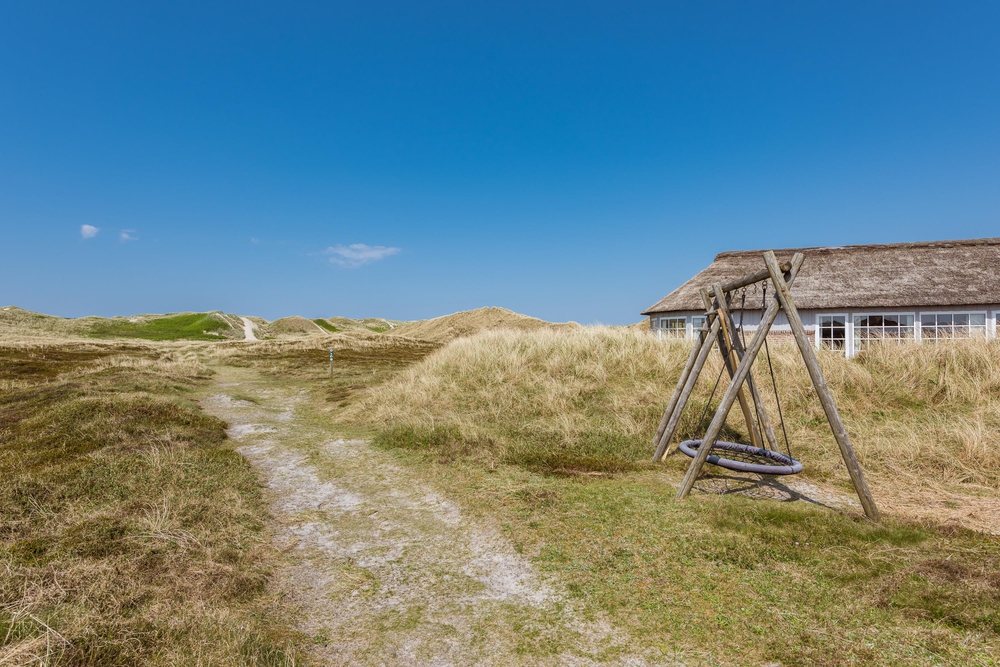 Poolhaus mit Panoramablick auf die Dünenlandschaft